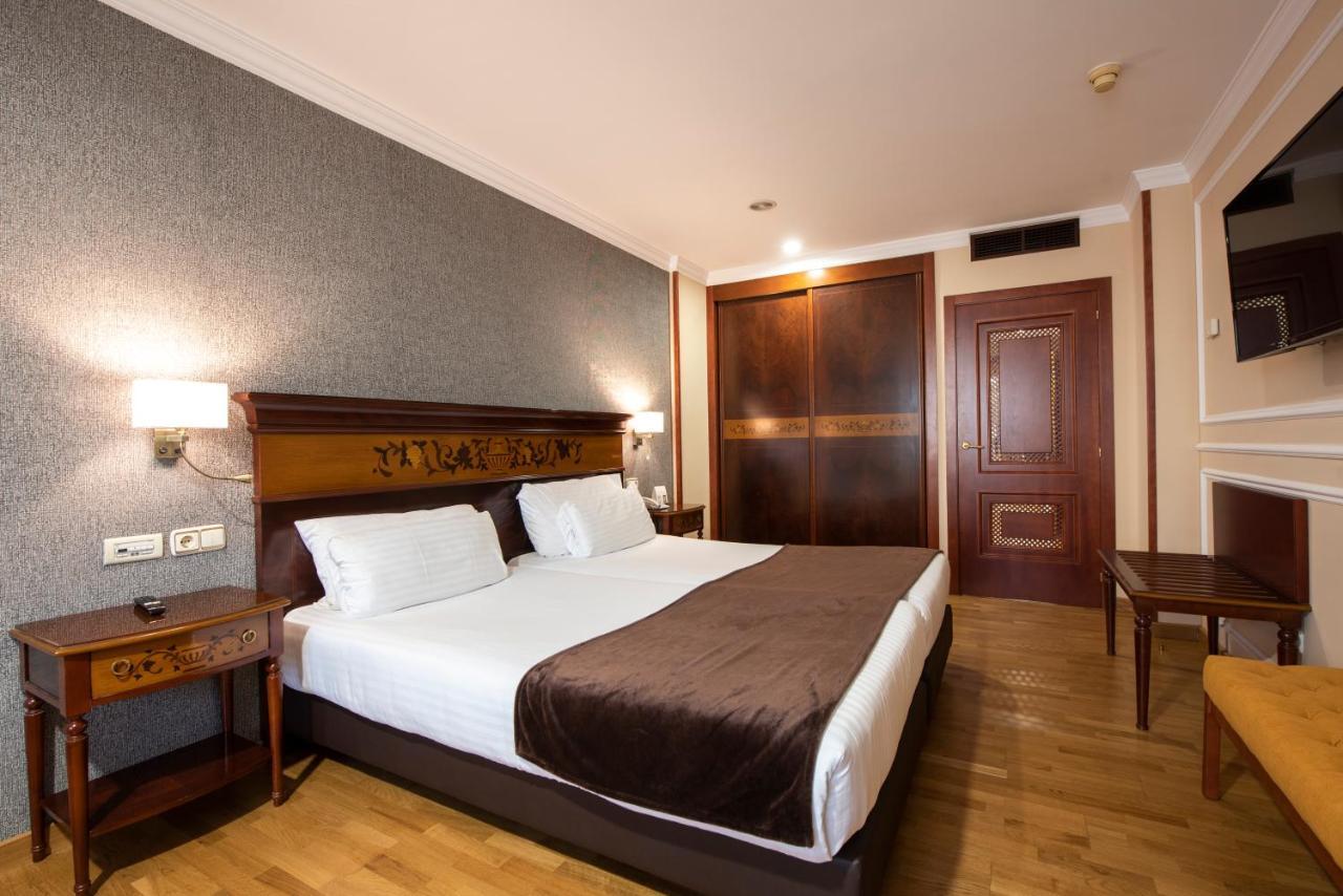 Eurostars Araguaney Hotel Santiago de Compostela Luaran gambar A bedroom in a hotel